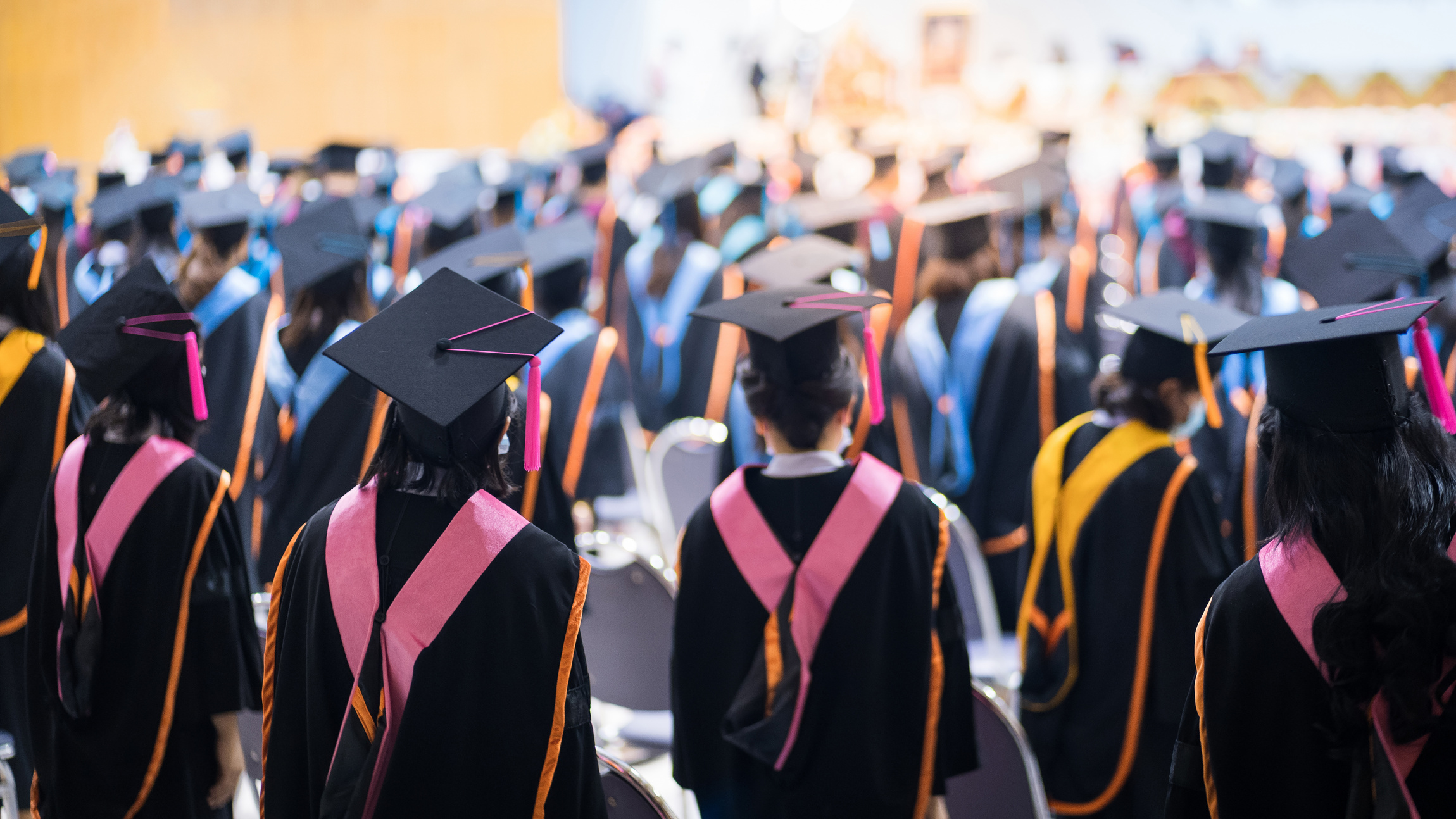 Rearview of the University Graduates Line up for Degree Award in